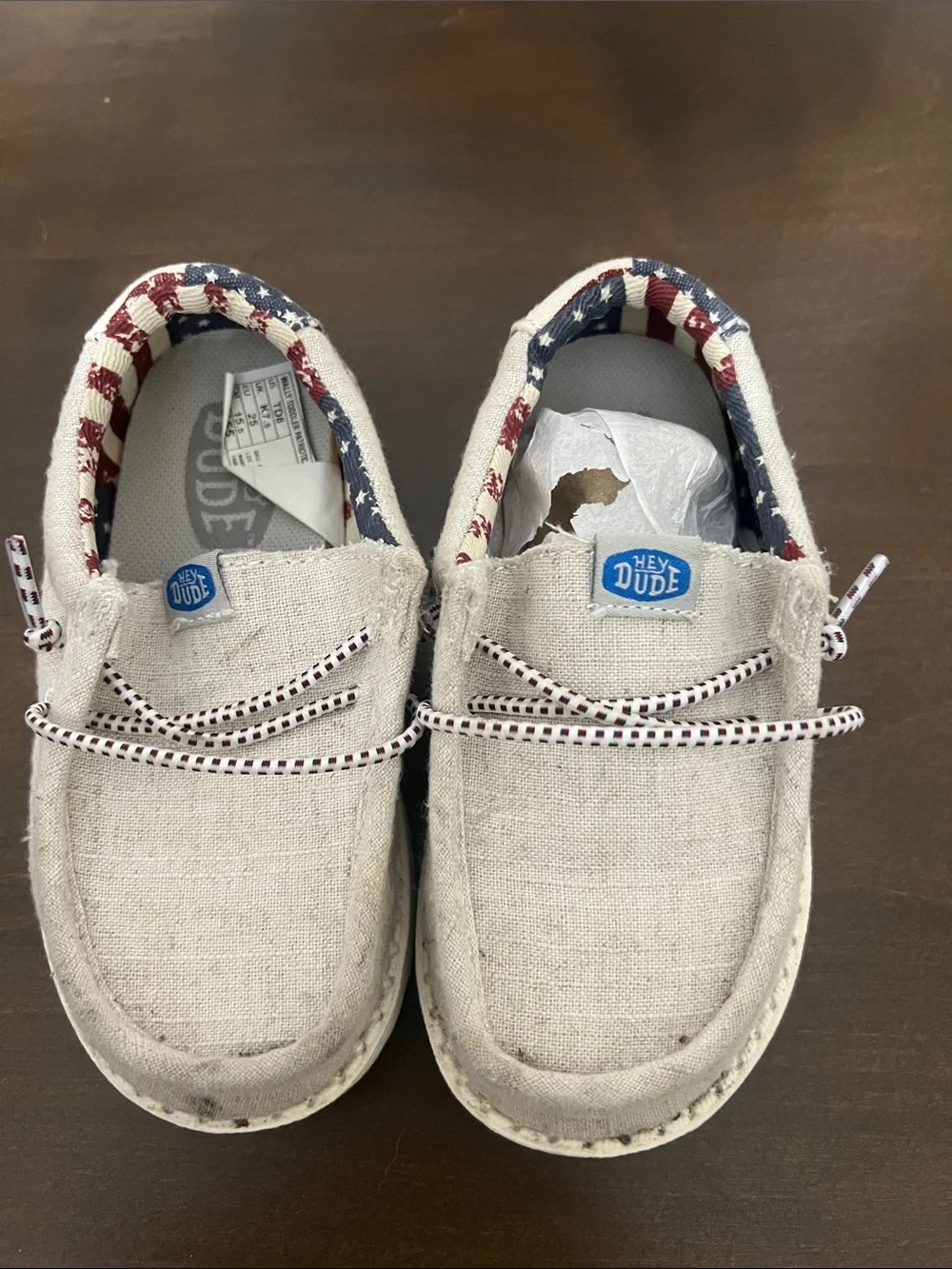 Hey Dude Kids Beige Canvas Slip-On Sneakers with Red, White & Blue Trim